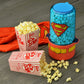 Superman Stir Popcorn Popper lifestyle photo with popcorn DCS-60CN Select Brands